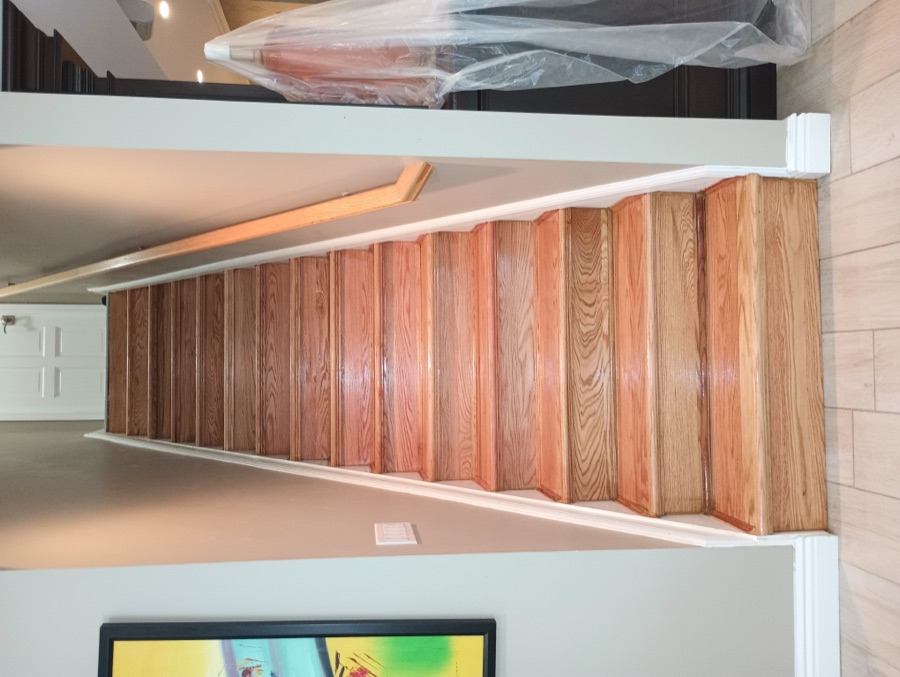 Refinished oak staircase and flooring from a full home renovation