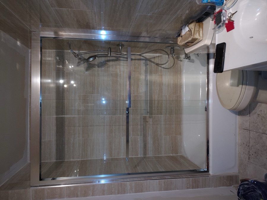 Tiled walk-in shower and tub surround installation